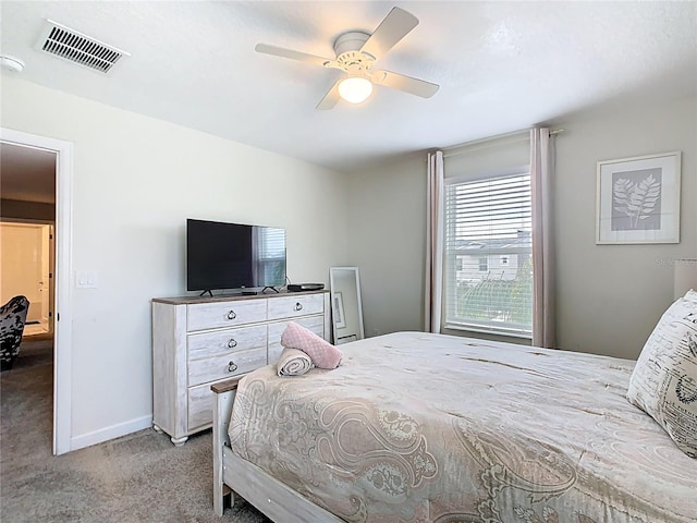 303 Ocean Course Ave, Davenport, FL 33896 - bedroom featuring carpet flooring, a ceiling fan, baseboards, and visible vents