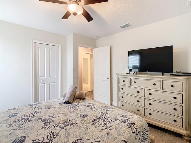303 Ocean Course Ave, Davenport, FL 33896 - carpeted bedroom featuring visible vents and a ceiling fan