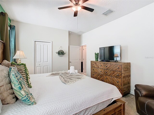 303 Ocean Course Ave, Davenport, FL 33896 - bedroom with carpet flooring, a ceiling fan, baseboards, visible vents, and a closet