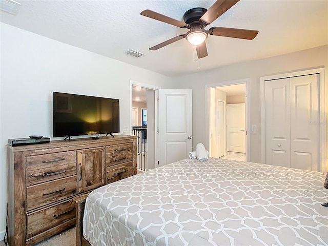 303 Ocean Course Ave, Davenport, FL 33896 - bedroom with a ceiling fan, visible vents, and a closet