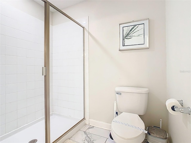 303 Ocean Course Ave, Davenport, FL 33896 - full bathroom featuring marble finish floor, toilet, and a shower stall