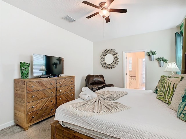 303 Ocean Course Ave, Davenport, FL 33896 - bedroom with baseboards, ensuite bathroom, a ceiling fan, and visible vents