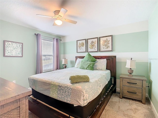 303 Ocean Course Ave, Davenport, FL 33896 - bedroom featuring baseboards, ceiling fan, and light carpet