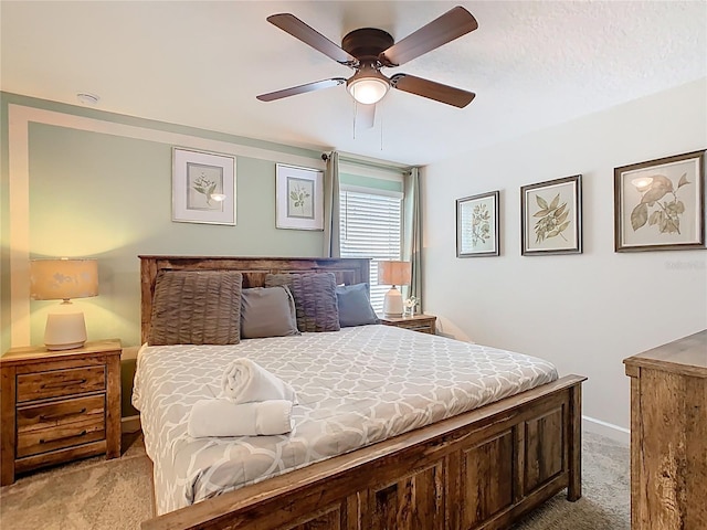 303 Ocean Course Ave, Davenport, FL 33896 - bedroom with a ceiling fan, baseboards, and light carpet