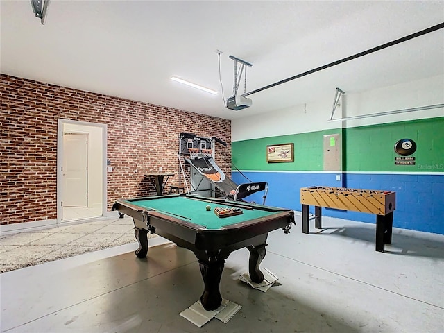 303 Ocean Course Ave, Davenport, FL 33896 - rec room featuring pool table, concrete flooring, brick wall, and a garage