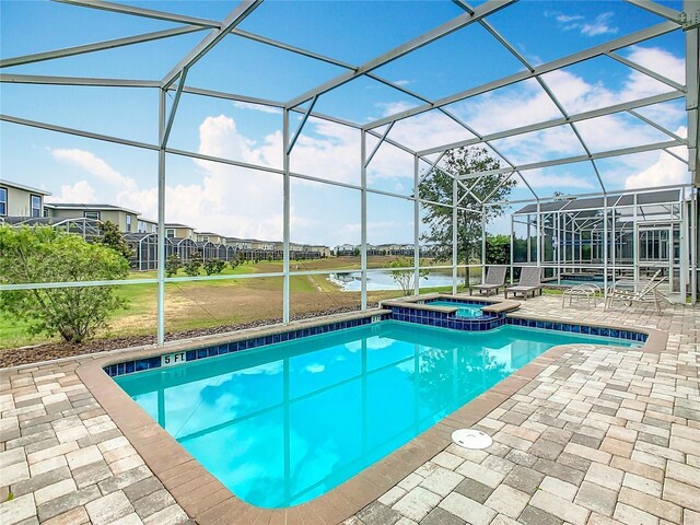 303 Ocean Course Ave, Davenport, FL 33896 - view of pool with a water view, a pool with connected hot tub, a lanai, and a patio