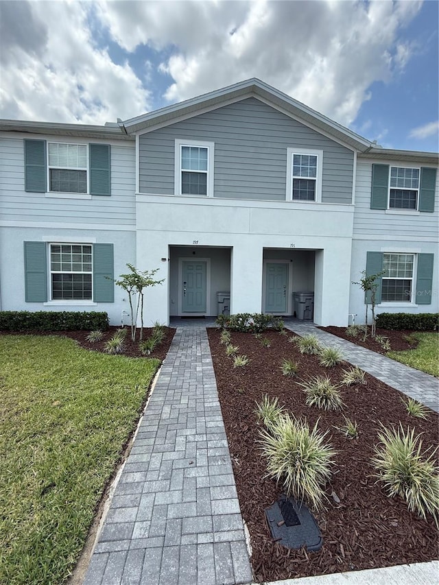 197 Jetty Way, Davenport, FL 33897 - multi unit property featuring a front yard and stucco siding