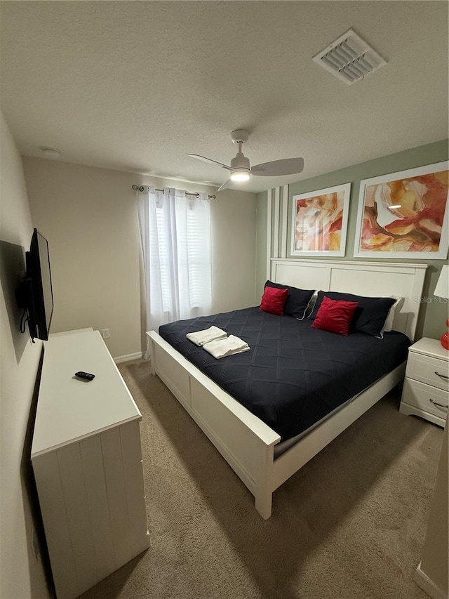197 Jetty Way, Davenport, FL 33897 - carpeted bedroom featuring a ceiling fan and a textured ceiling