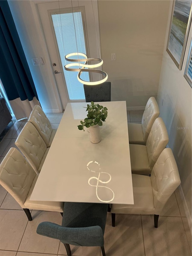 197 Jetty Way, Davenport, FL 33897 - tiled dining area featuring baseboards