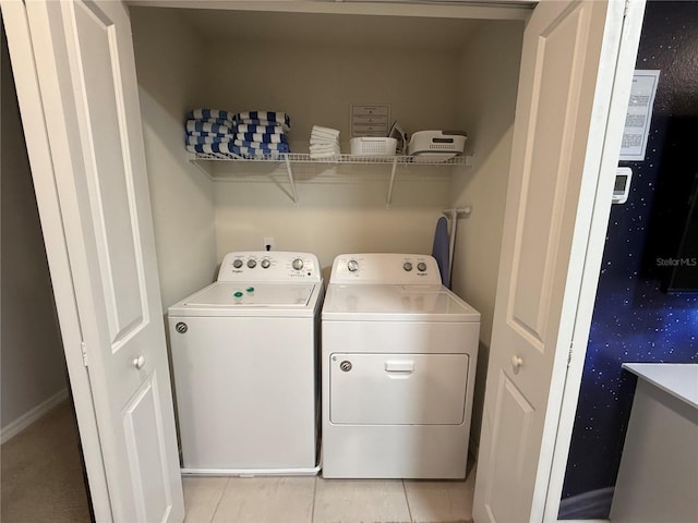 197 Jetty Way, Davenport, FL 33897 - laundry area featuring washing machine and dryer and light tile patterned floors