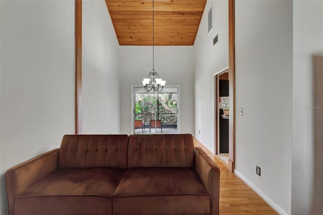 9503 Alice Ln, Riverview, FL 33578 - living room featuring a chandelier, wood ceiling, wood finished floors, and high vaulted ceiling