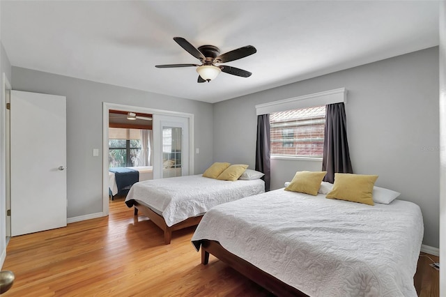 9503 Alice Ln, Riverview, FL 33578 - bedroom with light wood-style flooring and a ceiling fan