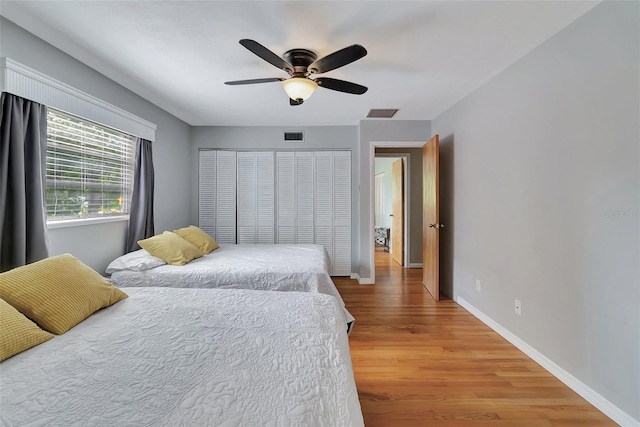 9503 Alice Ln, Riverview, FL 33578 - bedroom with wood finished floors and ceiling fan