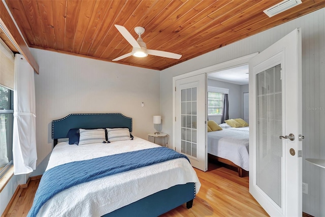 9503 Alice Ln, Riverview, FL 33578 - bedroom with wood finished floors, wood ceiling, and a ceiling fan