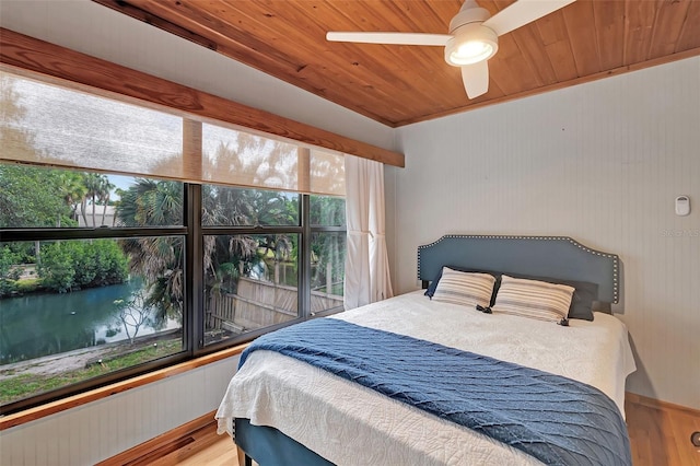 9503 Alice Ln, Riverview, FL 33578 - bedroom featuring wood ceiling, wood finished floors, a water view, and ceiling fan