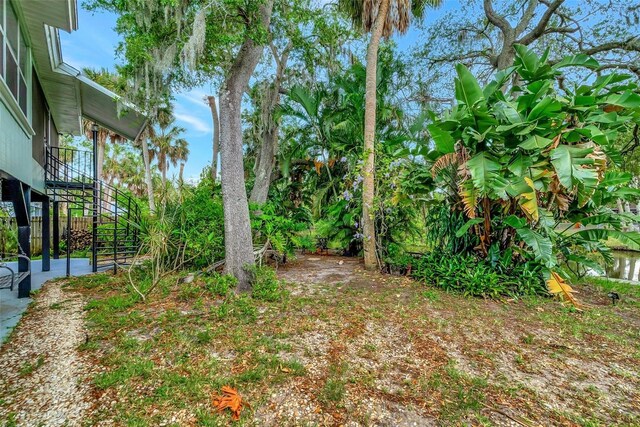 9503 Alice Ln, Riverview, FL 33578 - view of yard featuring stairway and a patio area