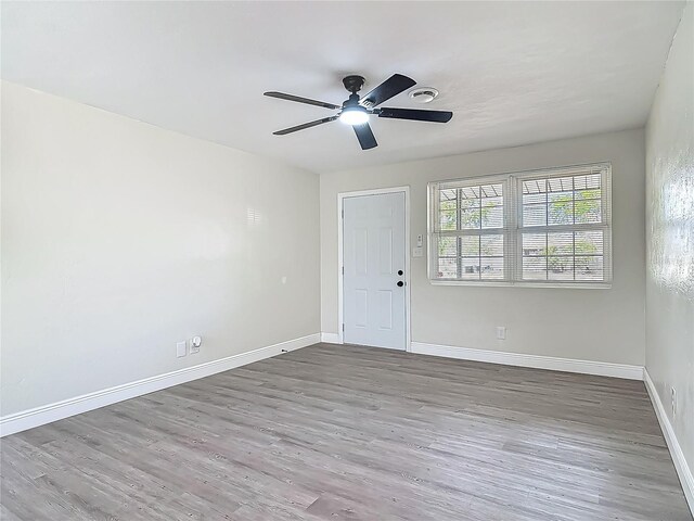 1298 Scottsdale Dr, Ormond Beach, FL 32174 - empty room with a ceiling fan, baseboards, visible vents, and wood finished floors
