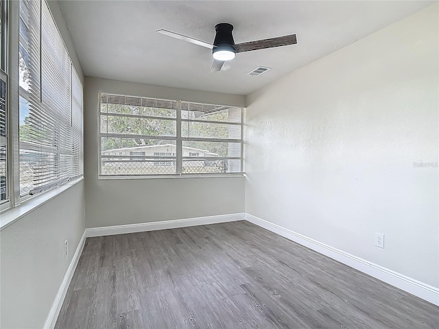 1298 Scottsdale Dr, Ormond Beach, FL 32174 - empty room with visible vents, a ceiling fan, baseboards, and wood finished floors