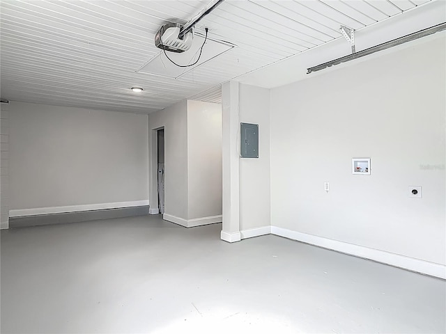 1298 Scottsdale Dr, Ormond Beach, FL 32174 - garage featuring baseboards, a garage door opener, and electric panel