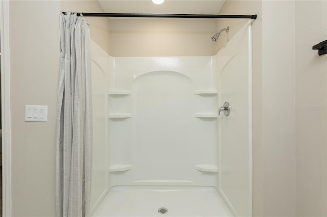 bathroom with curtained shower