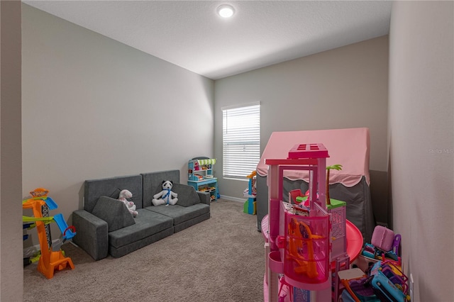 playroom with baseboards and carpet