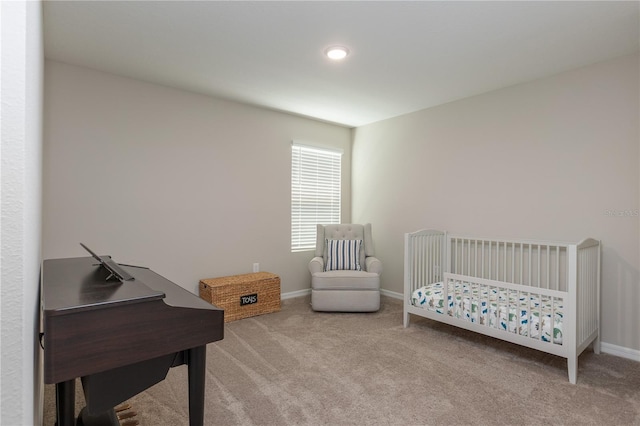 bedroom featuring carpet floors and baseboards