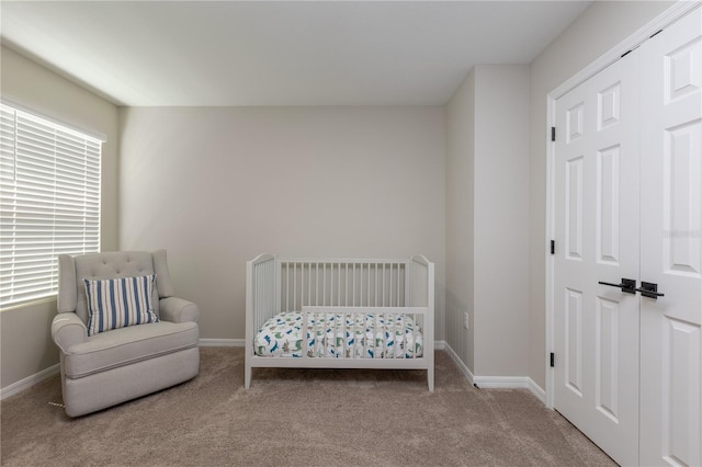 bedroom with carpet floors and baseboards