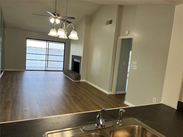 4109 Fairview Vista Pt Unit 315, Orlando, FL 32804 - unfurnished living room featuring a ceiling fan, visible vents, a sink, and wood finished floors