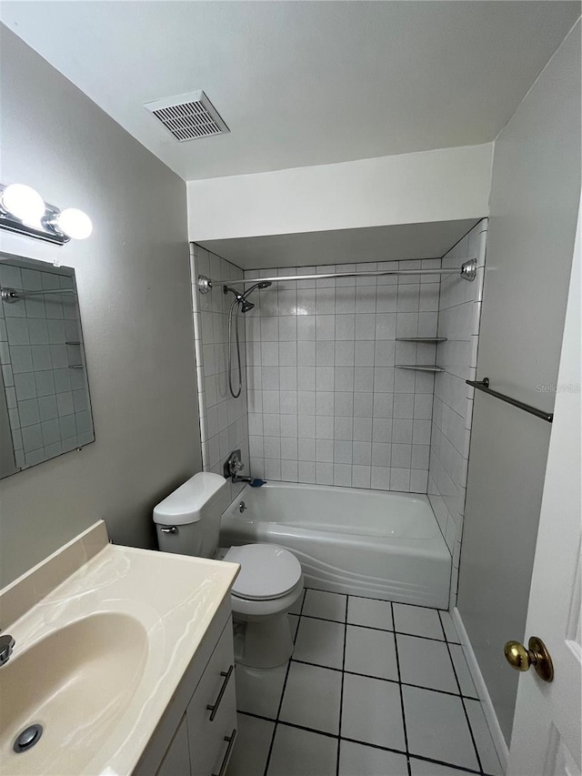 4109 Fairview Vista Pt Unit 315, Orlando, FL 32804 - bathroom with washtub / shower combination, tile patterned flooring, vanity, toilet, and visible vents