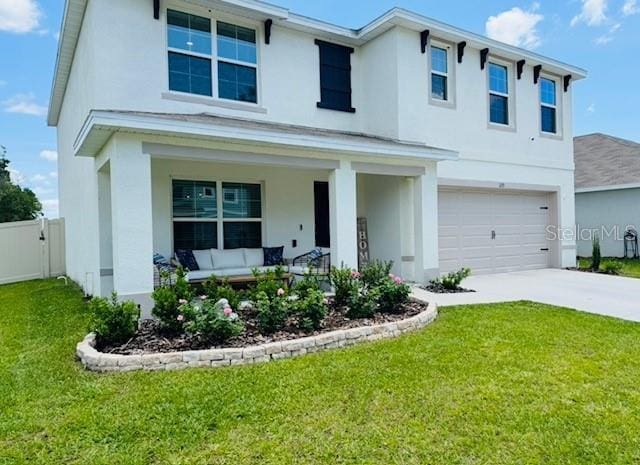 view of front of property featuring stucco siding, an attached garage, and a porch