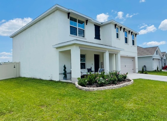 view of front of house with stucco siding, an attached garage, driveway, and covered porch