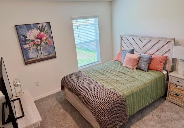 bedroom featuring carpet flooring and baseboards
