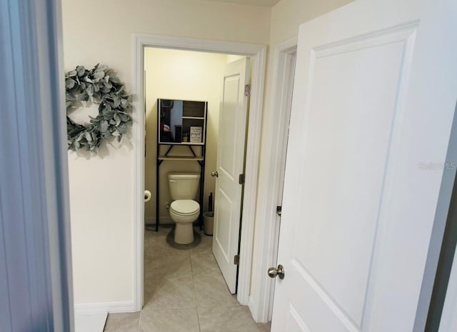 bathroom with tile patterned floors and toilet