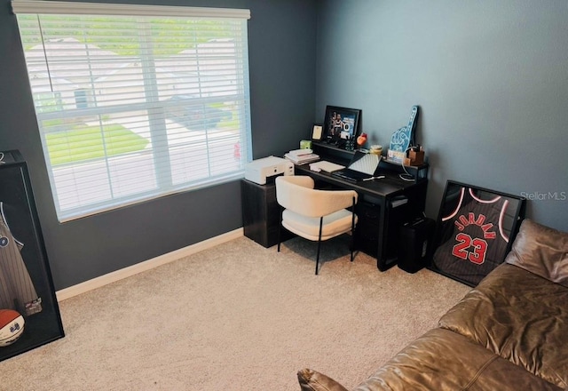 carpeted office space with baseboards