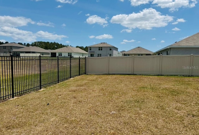 view of yard featuring a residential view