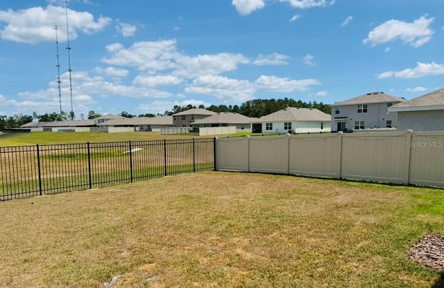 view of yard featuring a residential view