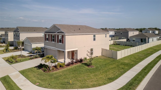 view of side of property with a residential view, an attached garage, stucco siding, driveway, and a shingled roof