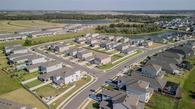 aerial perspective of suburban area featuring a nearby body of water