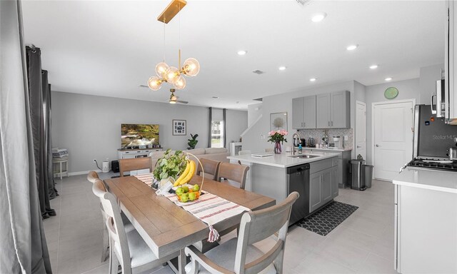 dining space featuring recessed lighting and a chandelier