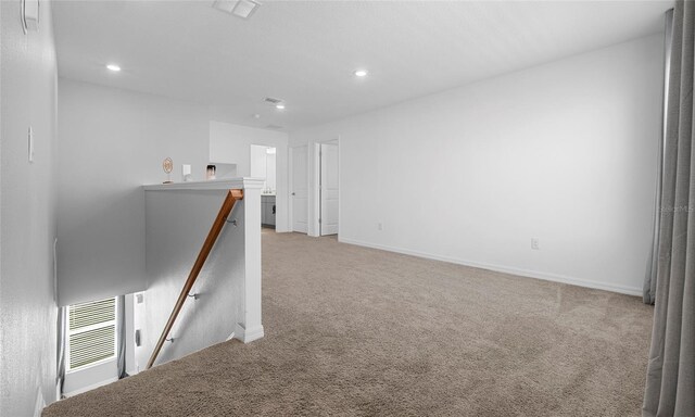 spare room with carpet flooring, recessed lighting, and baseboards