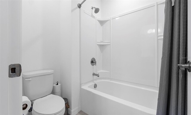 full bath featuring toilet and shower / bath combination with curtain
