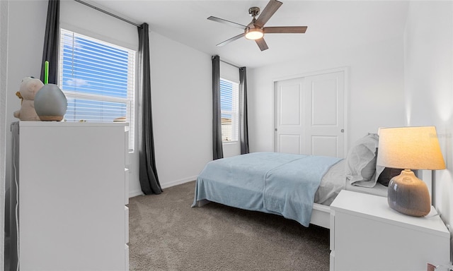 bedroom with carpet, ceiling fan, a closet, and baseboards