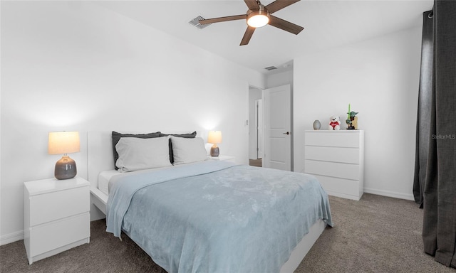 carpeted bedroom featuring baseboards and a ceiling fan