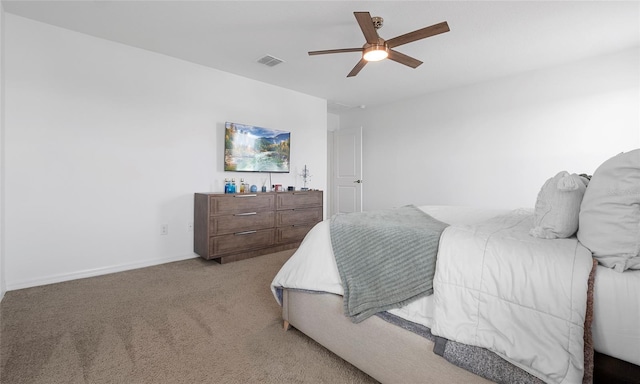 bedroom featuring light carpet, baseboards, and ceiling fan
