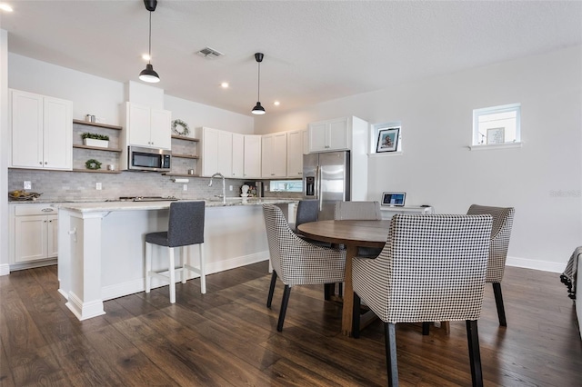 dining area featuring recessed lighting, baseboards, dark wood-style floors, and visible vents
