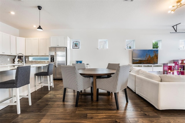 dining space with visible vents and dark wood-style floors