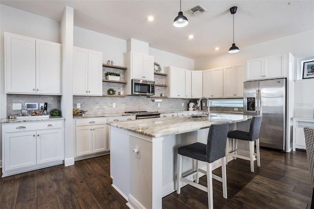 kitchen with visible vents, open shelves, tasteful backsplash, a sink, and appliances with stainless steel finishes