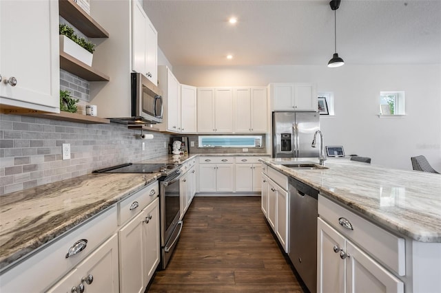 kitchen with open shelves, dark wood-type flooring, white cabinets, tasteful backsplash, and appliances with stainless steel finishes