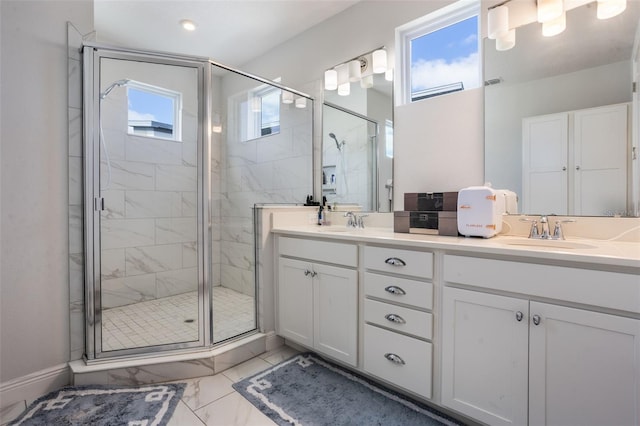 full bathroom featuring a sink, a marble finish shower, and marble finish floor