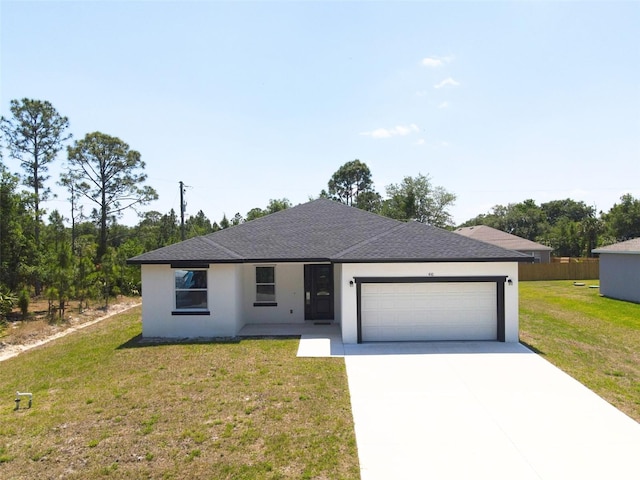 ranch-style home with an attached garage, stucco siding, concrete driveway, a front lawn, and roof with shingles